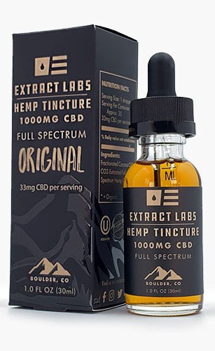 Extract Labs Full Spectrum CBD Oil 1000mg A bluclear extract labs bottle next to the black box it was inside of with hemp tincture 1000mg CBD written on it